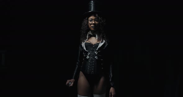 Magician in Top Hat with Cane in Hand Is Posing Sexy Woman Film Grain