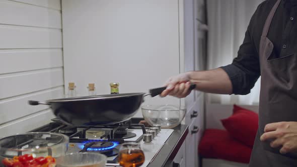 Roasting Vegetables and Chicken in a Wok Over a Fire