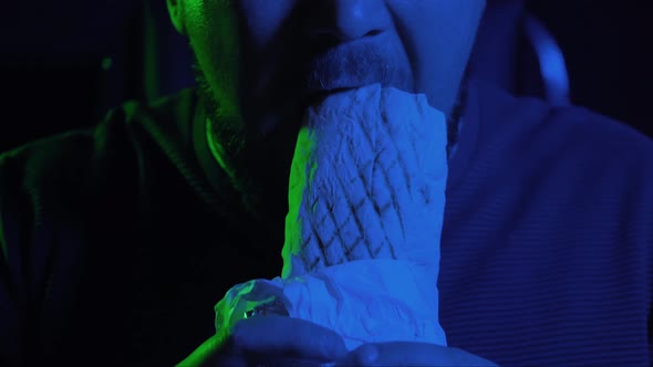 A Man Eats a Delicious Shawarma