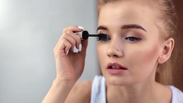 Closeup Portrait of Beautiful Girl Dye Eyelashes Use Mascara Brush