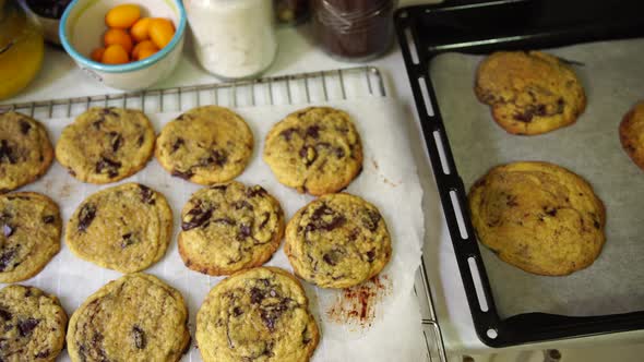 Readymade American Cookies with Chocolate Chips Lie on the Table on Baking Sheets