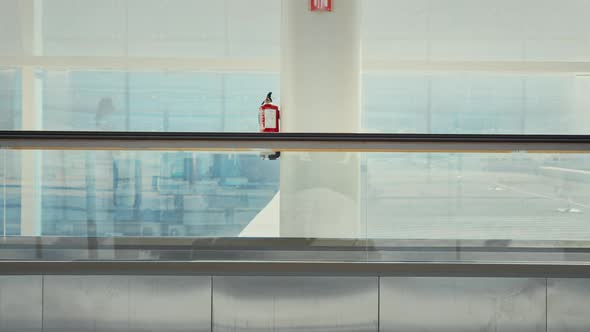 Young Millennial Traveler Woman in Empty Airport