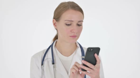 Female Doctor Browsing Smartphone on White Background