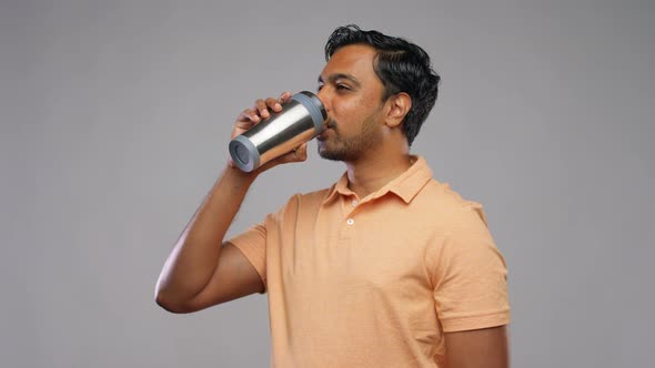 Indian Man with Thermo Cup or Tumbler for Drink