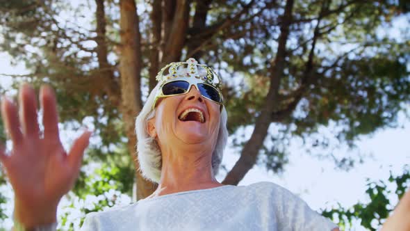 Senior woman wearing party props