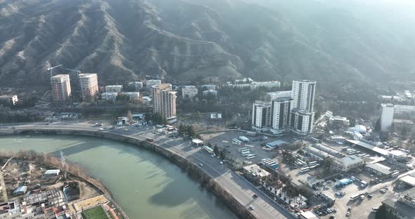 Aerial view of Ortachala district at sunset. cityscape over Kura river in Tbilisi, Georgia 2022