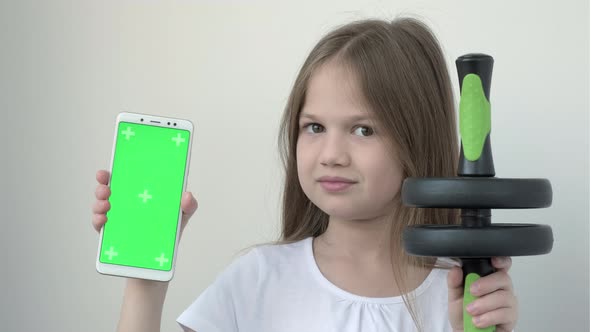 Kid Girl Shows Ab Wheel Sports Equipment and Phone with Green Screen