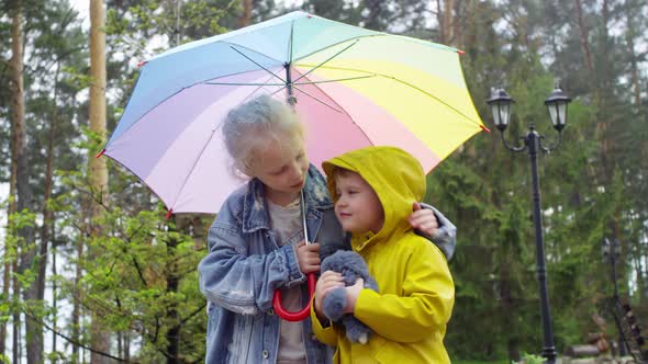 Cute Children under Umbrella