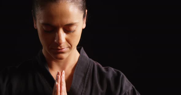 Karate player in prayer pose