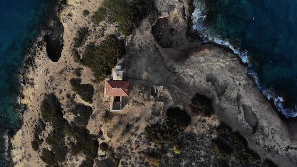 Copter Fly Around the Small Island with Old House Surrounded By Sea Space