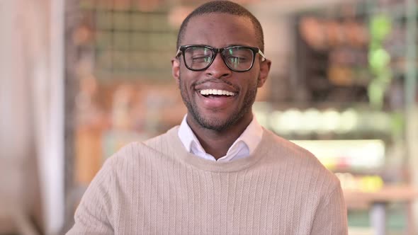 Portrait of Positive African Man Doing Thumbs Up