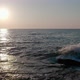 The waves crash against the rocky sea coast. Sunset. - VideoHive Item for Sale