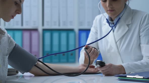 Doctor measuring a patient's blood pressure