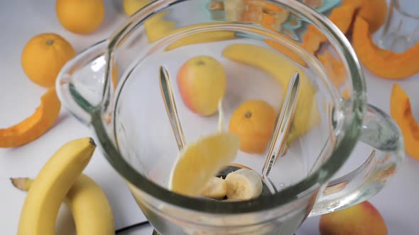 Fruit Falling Into a Blender