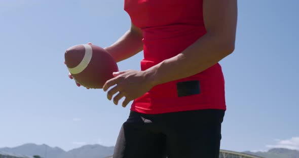 American football player holding a ball