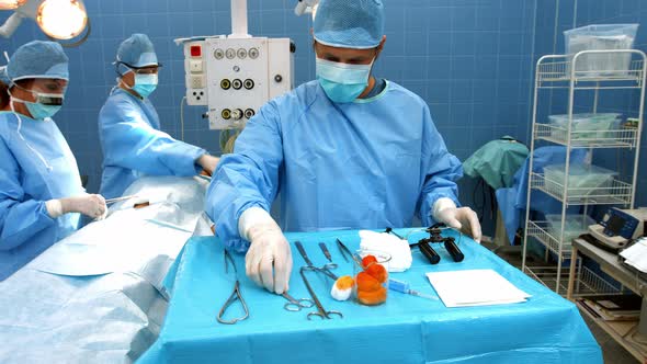 Surgeons performing operation in operation room