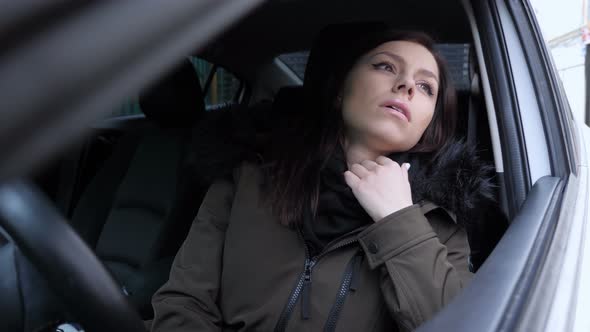 Sad Woman Feeling Bad, Crying while Sitting in Car