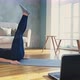 Woman in Skinny Tracksuit Does Crunches and Leg Lifts - VideoHive Item for Sale