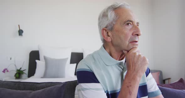 Animation of thoughtful caucasian senior man looking at camera