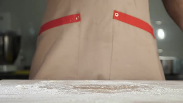 Chef Baker Man in Apron Prepares the Dough