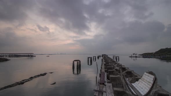 Timelapse sunrise of broken pillar at the fisherman village