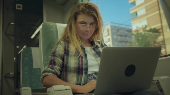 Young Woman Work Laptop When Commute By Train