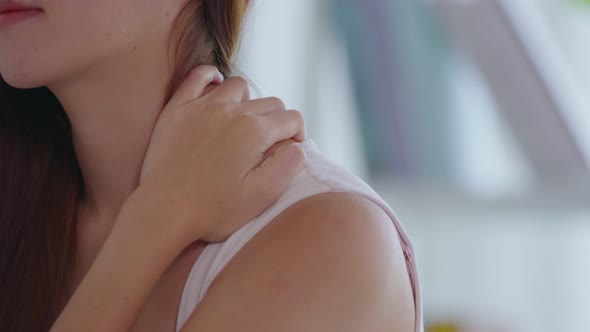 Close up hand of Asian young woman have a neck and shoulder pain after wake up