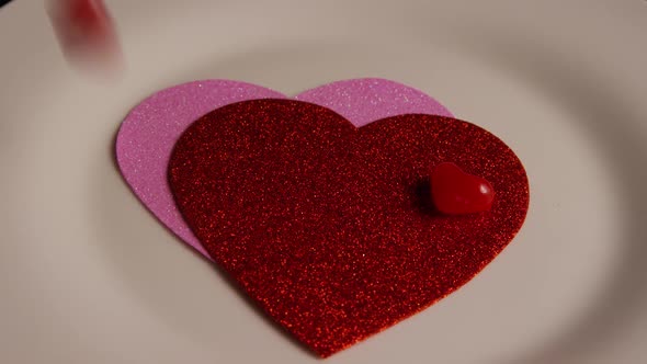 Rotating stock footage shot of Valentines decorations and candies - VALENTINES 0114