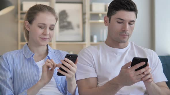 Man and Woman Using Smartphone, Messaging