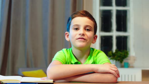 In Front of the Camera a Little Boy in His Room