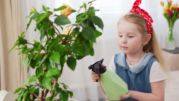 a Little Cute Girl Sprays the Houseplant with Water