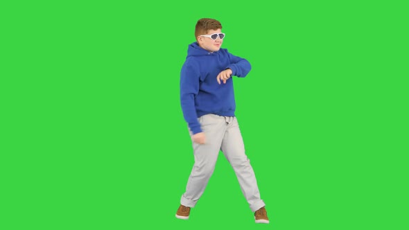 Happy Boy in Shades Dancing Really Cool on a Green Screen Chroma Key