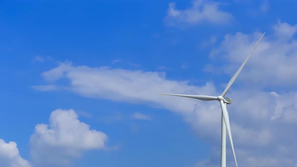 Time-lapse of Wind Turbine in wind farm with cloud sky