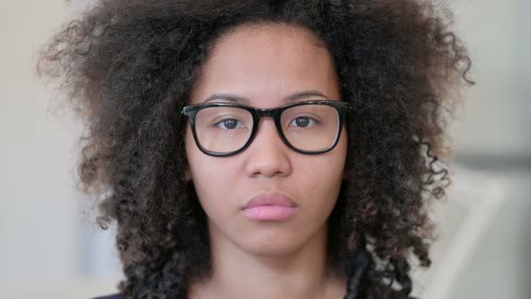 Close Up of Serious African Woman Looking at the Camera