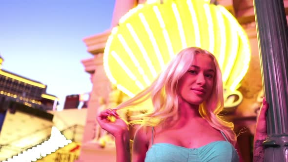 Young Sexy Blonde Woman in Shiny Exterior of Las Vegas Strip USA Slow Motion