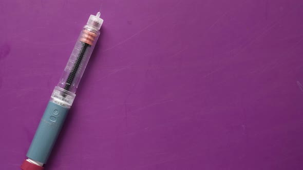 Insulin Pens and Diabetic Measurement Tools on Color Background Close Up