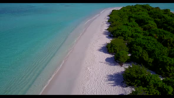 Aerial top down abstract of marine seashore beach time by transparent ocean with white sand backgrou