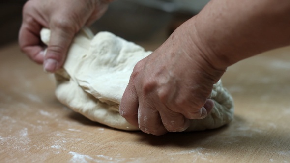 Woman Kneading Dough