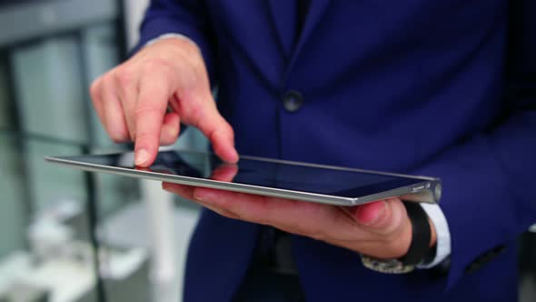 Businessman using digital tablet in office