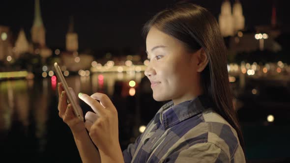 Happy Woman Browsing the Internet on Tablet Device