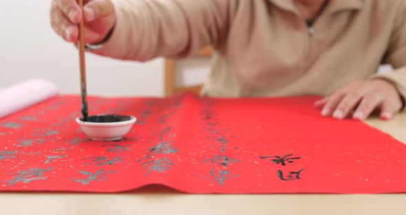 Writing chinese calligraphy with word meaning luck