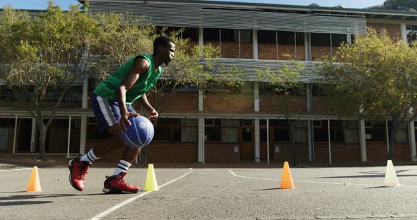 Basketball player practicing dribbling drill