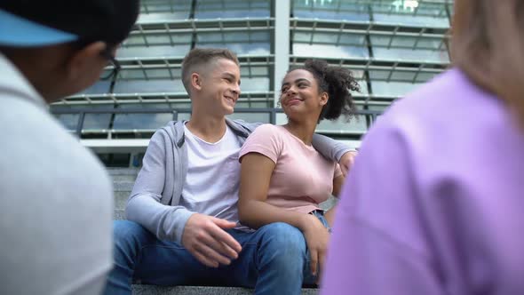 Teenage Couples Talking and Laughing, Having Fun Together Outdoors, Friendship