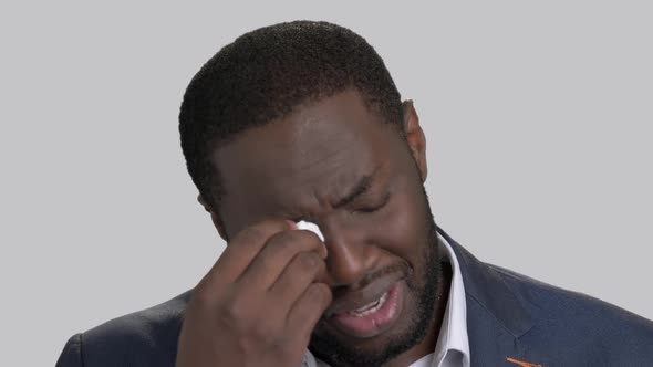 Crying Black Businessman in Full Despair.