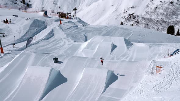 Huge Ski Park in St Anton Ski Resort with Skiers Jumping Down the Kickers and Sliders