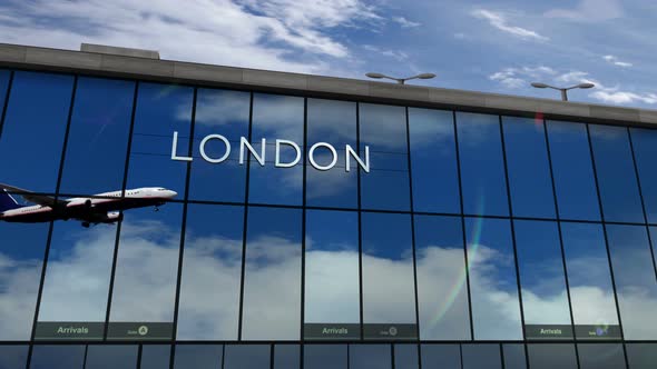 Airplane landing at London England, UK airport mirrored in terminal