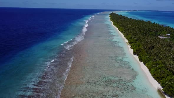 Paradise Tropical Island in Indian oceanDrone Flying Forward Near Maldives Islands Waves Wash