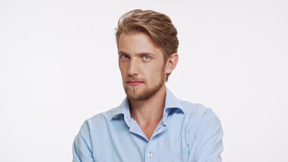 Sexy Caucasian Bearded Male with Blue Eyes and Brown Beard Ogles and Touching Hair on White