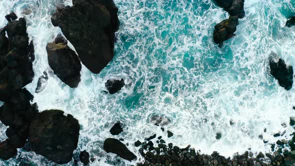 Breaking Foamy Waves On Rocky Shoreline Of Reykjanes Peninsula, Iceland. Aerial