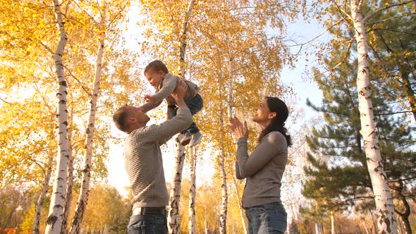 Family with Baby at Autumn Park